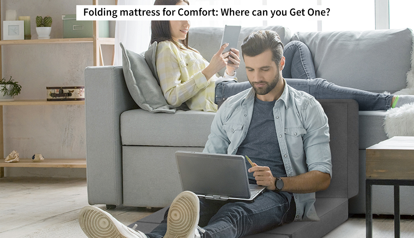 Men with Laptop on Foldable Mattress with lady in sofa
